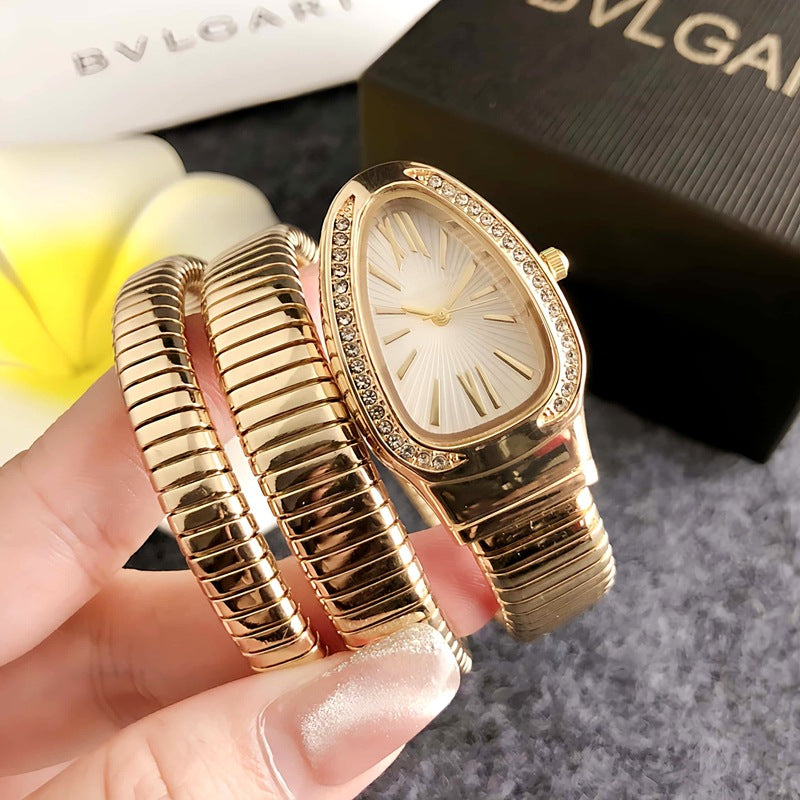 Montre femme Serpentine dorée avec cadran blanc