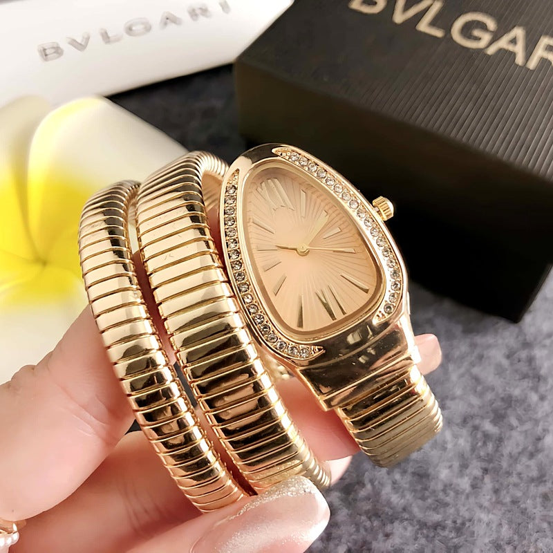 Montre femme Serpentine dorée avec cadran champagne