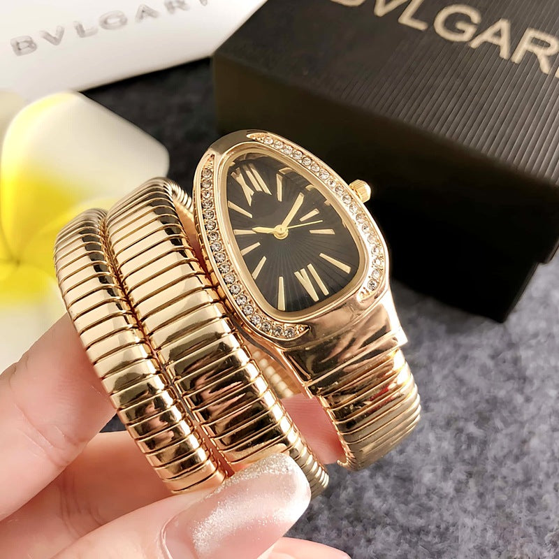 Montre femme Serpentine dorée avec cadran noir